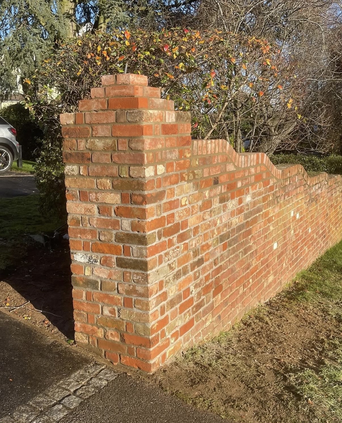Brickwork stitch in after a car knocked the end of the wall down